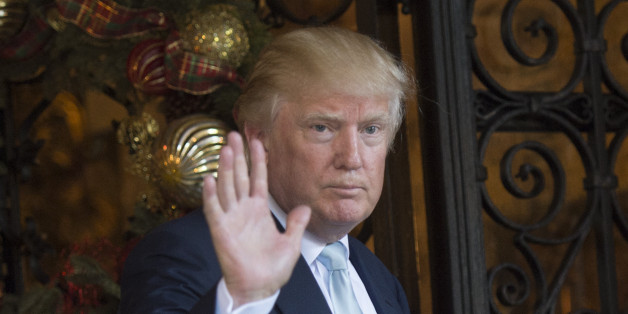 US President-elect Donald Trump waves to reporters between meetings December 28, 2016 at Mar-a-Lago in Palm Beach, Florida. / AFP / DON EMMERT (Photo credit should read DON EMMERT/AFP/Getty Images)