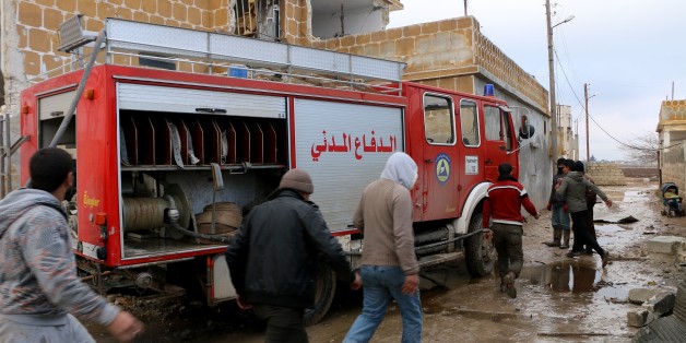 ALEPPO, SYRIA - DECEMBER 29: Fire fighters try to extinguish a fire after a car bombing attack at the opposition controlled Soran district of Aleppo, Syria on December 29, 2016. (Photo by Majd al Halebi /Anadolu Agency/Getty Images)