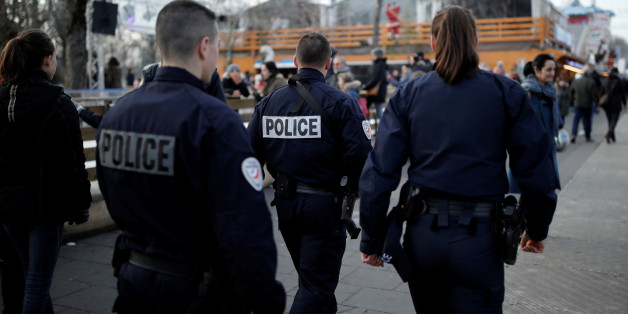 French police officers patrol a Christmas market on the Champs Elysees Avenue as emergency security measures continue in Paris, France, December 20, 2016. REUTERS/Benoit Tessier