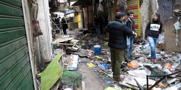 Iraqi security forces inspect the site of a bomb attack at a market in central Baghdad, Iraq December 31, 2016. REUTERS/Ali al-Mashhadani