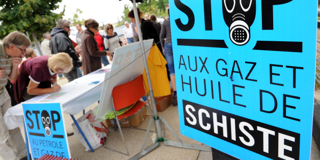 People sign a petition against the exploitation of shale gas and oil during a rally on September 22, 2012 in Saint-Christol-les-Ales, southern France. France's president revoked seven licenses to exploit shale gaz on September 14, arguing that 'no one can say that the exploitation of gas and oil shale by hydraulic fracturing, known only technique today is free of heavy risks to health and the environment'. AFP PHOTO SYLVAIN THOMAS (Photo credit should read SYLVAIN THOMAS/AFP/GettyImages)