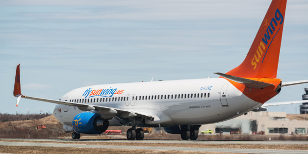 Goffs, Canada - May 3, 2015: A Sunwing Airlines flight taxis towards the gate at Halifax Stanfield International Airport.
