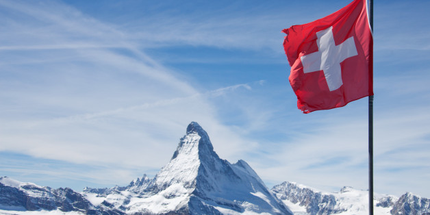The Matterhorn Switzerland with swiss flag in Zermatt, Switzerland