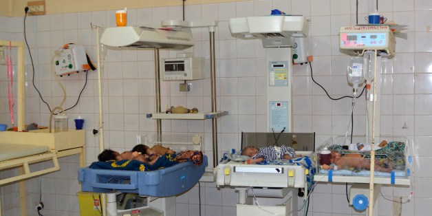 TO GO WITH AFP STORY BY BOUREIMA HAMABabies are seen in incubators at the maternity of Niamey on April 24, 2014. Niger's government and humanitarians fight against the very high maternal mortality in Niger, a poor country with the highest fertility in the world. AFP PHOTO/ BOUREIMA HAMA (Photo credit should read BOUREIMA HAMA/AFP/Getty Images)