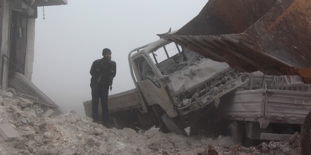 ALEPPO, SYRIA - JANUARY 1: A man inspects the area after warcrafts belonging to Assad Regime forces attacked with vacuum bomb to Etarib district of Aleppo, Syria on January 1, 2017. Assad regime and its supporter foreign terrorists violate the ceasefire between Syrian opposition groups and the Syrian government. (Photo by Ahmed al Ahmed/Anadolu Agency/Getty Images)