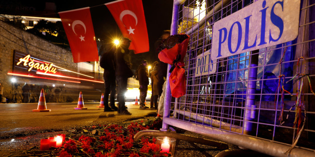 Flowers are placed in front of a police barrier near the entrance of Reina nightclub by the Bosphorus, which was attacked by a gunman, in Istanbul, Turkey, January 1, 2017. REUTERS/Umit Bektas