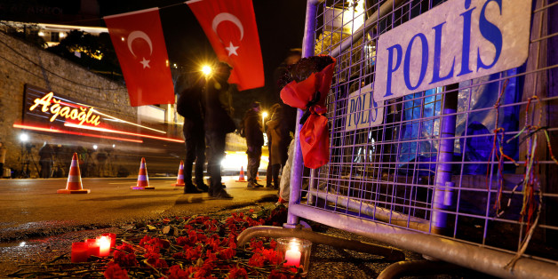Flowers are placed in front of a police barrier near the entrance of Reina nightclub by the Bosphorus, which was attacked by a gunman, in Istanbul, Turkey, January 1, 2017. REUTERS/Umit Bektas