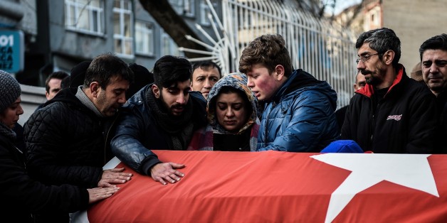Relatives of Ayhan Arik, one of the victims of the Reina night club attack mourn during his funeral ceremony on January 1, 2017 in Istanbul.Thirty-nine people, including many foreigners, were killed early on January 1, 2016 when a gunman went on a rampage at an exclusive nightclub in Istanbul where revellers were celebrating the New Year. / AFP / OZAN KOSE (Photo credit should read OZAN KOSE/AFP/Getty Images)