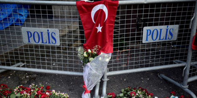 Flowers and a Turkish flag are placed near the entrance of Reina nightclub, which was attacked by a gunman, in Istanbul, Turkey January 2, 2017. REUTERS/Yagiz Karahan