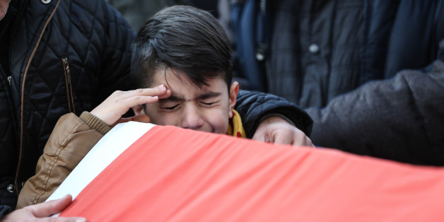 ISTANBUL, TURKEY - JANUARY 1: Relatives and friends mourn at a coffin during the funeral of Ayhan Arik, one of the 39 victims of the gun attack on the Reina, a popular night club in Istanbul near by the Bosphorus shores, in Istanbul, January 1, 2017, Turkey. According to Turkey's interior minister Suleyman Soylu at least 39 people, including at least 15 foreigners have been killed dead and 40 wounded at terror attack at Istanbul's famous night club of Reina in Bosphorus shores in the new year pa