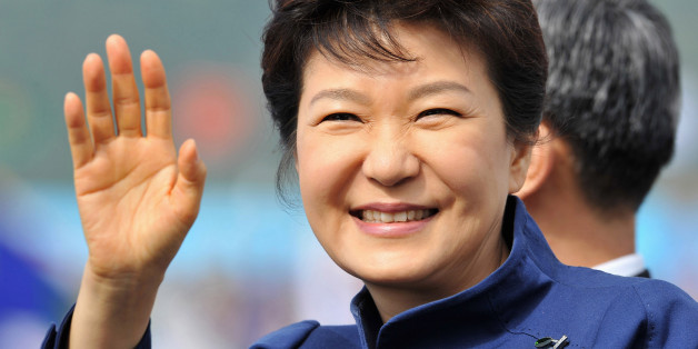 South Korean President Park Geun-Hye waves as she inspects troops during a ceremony marking the 65th anniversary of the founding of South Korea's Armed Forces at an air base in Seongnam, south of Seoul October 1, 2013. REUTERS/Jung Yeon-je/Pool (SOUTH KOREA - Tags: POLITICS MILITARY ANNIVERSARY)