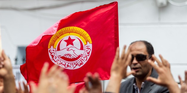 TUNIS, TUNISIA - MAY 1 : Tunisians gather outside the headquarters of the Tunisian General Labour Union UGTT to attend a May Day Rally in Tunis, Tunisia on May 1, 2016. (Photo by Amine Landoulsi/Anadolu Agency/Getty Images)