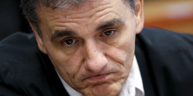 Greek Finance Minister Euclid Tsakalotos reacts at the start of a euro zone finance ministers meeting in Brussels, Belgium, August 14, 2015. Euro zone finance ministers will discuss whether to agree a third bailout package for Greece on Friday at their meeting in Brussels after the Greek parliament voted to approve the terms. REUTERS/Francois Lenoir