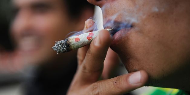 A man smokes marijuana during a demonstration in front of the Mexican Senate building in Mexico City on September 28, 2016.
Dozens of young people demand the approval of the use of marijuana for medicinal and recreational purposes. / AFP / PEDRO PARDO (Photo credit should read PEDRO PARDO/AFP/Getty Images)