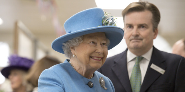 Britain's Queen Elizabeth (L) accompanied by Waitrose Marketing Director Rupert Thomas looks around a Waitrose supermarket during a visit to the town of Poundbury, Britain October 27, 2016. REUTERS/Justin Tallis/Pool