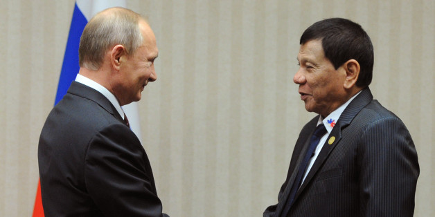 Russian President Vladimir Putin (L) meets with his Philippines' counterpart Rodrigo Duterte on the sidelines of the Asia-Pacific Economic Cooperation Summit (APEC) in Lima on November 19, 2016. / AFP / SPUTNIK / Mikhail KLIMENTYEV (Photo credit should read MIKHAIL KLIMENTYEV/AFP/Getty Images)