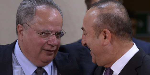 (LtoR) Greek Foreign Affairs Minister Nikolaos Kotzias talks with Turkish Foreign Affairs minister Mevlut Cavusoglu during a foreign affairs ministers meeting at the NATO headquarters in Brussels on May 19, 2016.
NATO foreign ministers met to finalise the alliance's biggest military build-up since the end of the Cold War to counter what they see as a more aggressive and unpredictable Russia. At a Warsaw summit in July, NATO leaders will sign-off on the revamp which puts more troops into east European member states as part of a 'deter and dialogue' strategy, meant to reassure allies they will not be left in the lurch in any repeat of the Ukraine crisis. / AFP / JOHN THYS (Photo credit should read JOHN THYS/AFP/Getty Images)