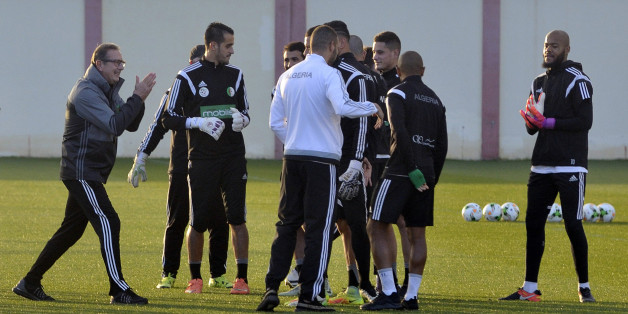 Algeria's Belgian coach George Leekens (L) applauds next to his players during a training session on January 4, 2017, at the National Technical Center in Sidi Moussa, during preparations for the upcoming 2017 Africa Cup of Nations in Gabon. / AFP / Ryad Kramdi (Photo credit should read RYAD KRAMDI/AFP/Getty Images)