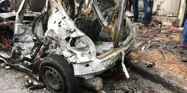 A general view shows a burnt-out vehicle at the site of a car bomb explosion in Syria's coastal city of Jablah, a bastion of the regime, on January 5, 2017. / AFP / STRINGER (Photo credit should read STRINGER/AFP/Getty Images)