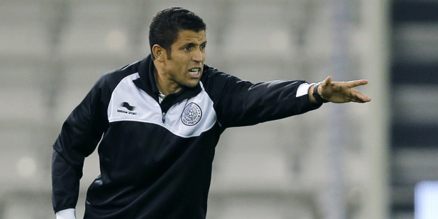 Al-Sadd's head coach AlHussein Ammouta gestures during the Qatar Stars League soccer match against Al-Rayyan in Doha February 19, 2013. REUTERS/Fadi Al-Assaad (QATAR - Tags: SPORT SOCCER)