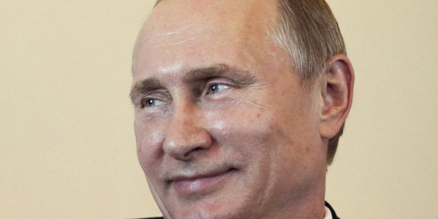 Russian President Vladimir Putin listens to his Kyrgyz counterpart Almazbek Atambayev (not pictured) during their meeting at the Constantine (Konstantinovsky) Palace in St. Petersburg March 16, 2015. Putin laughed off suggestions he had been forced to lie low because of poor health, saying on Monday that life would be "boring without gossip". REUTERS/Anatoly Maltsev/Pool (RUSSIA - Tags: POLITICS TPX IMAGES OF THE DAY)