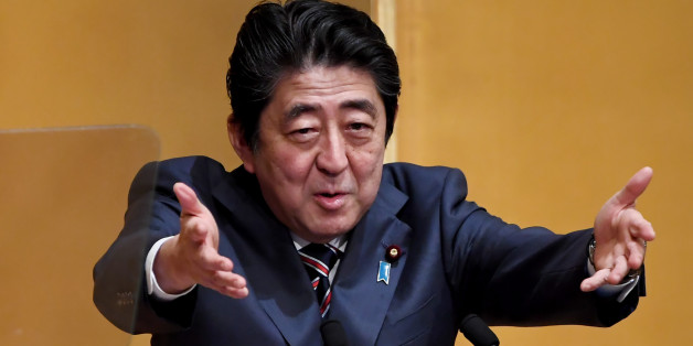 Japanese Prime Minister Shinzo Abe gestures while delivering his speech at a lecture hosted by the Naigai Josei Chosakai, or 'Investigation group on domestic and international affairs' in Tokyo on December 20, 2016. / AFP / TOSHIFUMI KITAMURA (Photo credit should read TOSHIFUMI KITAMURA/AFP/Getty Images)