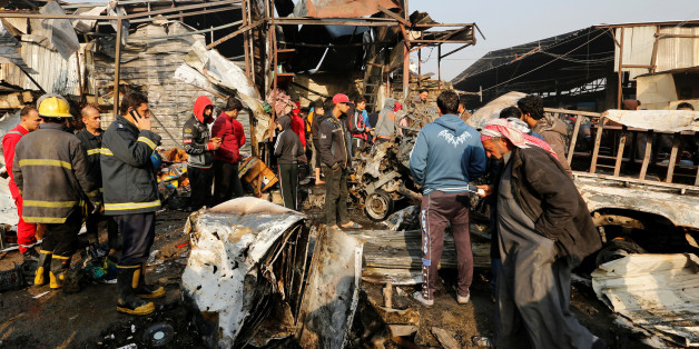 Firemen and people gather at the site of a car bomb attack at a vegetable market in eastern Baghdad, Iraq, January 8, 2017. REUTERS/Wissm al-Okili