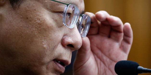 SEOUL, SOUTH KOREA - DECEMBER 22: Woo Byung-Woo, South Korean former senior presidential aide. attends a parliamentary hearing over the Choi Soon-sil gate probe at the National Assembly on December 22, 2016 in Seoul, South Korea. The two are critical witnesses in the hearing investigating the corruption scandal surrounding South Korean President Park Geun-hye and her confidante Choi Soon-sil. (Photo by Jeon Heon-Kyun-Pool/Getty Images)