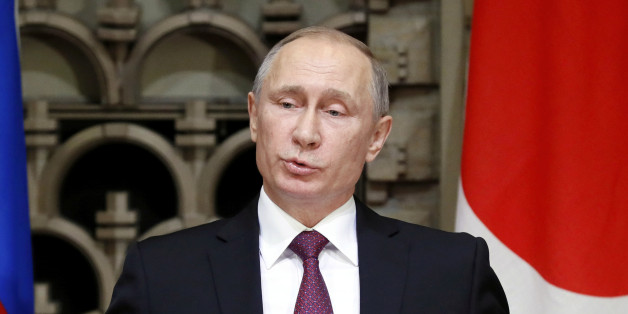 Russian President Vladimir Putin gestures as he speaks during a joint news conference with Japanese Prime Minister Shinzo Abe in Tokyo, Japan, December 16, 2016. REUTERS/Alexander Zemlianichenko/Pool
