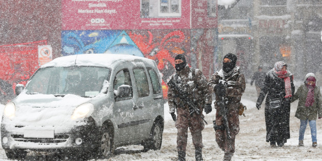 Members of police special forces patrol at the main shopping and pedestrian street of Istiklal during a snowfall in central Istanbul, Turkey January 9, 2017. REUTERS/Murad Sezer