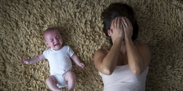 Stressed mother and her baby.
