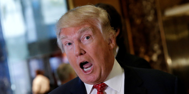 U.S. President-elect Donald Trump reacts to questions from reporters in the lobby at Trump Tower in New York, U.S., January 9, 2017. REUTERS/Mike Segar
