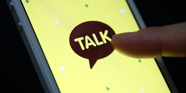 The logo of KakaoTalk, a messaging app developed by Kakao Corp., is displayed on an Apple Inc. iPhone 5 in this arranged photograph taken in Seoul, South Korea, on Monday, Dec. 30, 2013. Kakao is South Korea's biggest mobile messenger operator. Photographer: SeongJoon Cho/Bloomberg via Getty Images