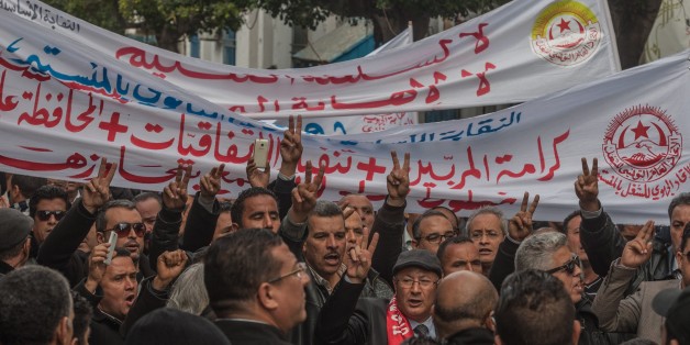 TUNIS, TUNISIA - NOVEMBER 29: A group of teachers gathered in front of the National Education Ministry march to Al-Kasaba square, where the state house is, during a protest against the government's 2017 budget in Tunis, Tunisia on November 29, 2016. Protestors demanded the resignation of the National Education Minister Neji Jalloul. (Photo by Amine Landoulsi/Anadolu Agency/Getty Images)