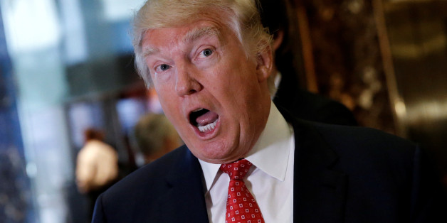 U.S. President-elect Donald Trump reacts to questions from reporters in the lobby at Trump Tower in New York, U.S., January 9, 2017. REUTERS/Mike Segar