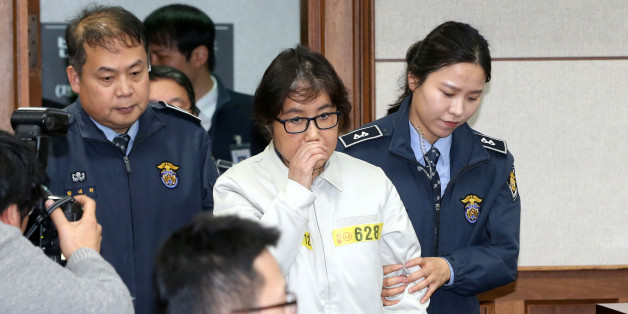 Choi Soon-sil, a long-time friend of South Korean President Park Geun-hye who is at the center of the South Korean political scandal involving Park, arrives for her first court hearing in Seoul, South Korea, December 19, 2016. Korea Pool/via REUTERS ATTENTION EDITORS - THIS IMAGE HAS BEEN SUPPLIED BY A THIRD PARTY. SOUTH KOREA OUT.