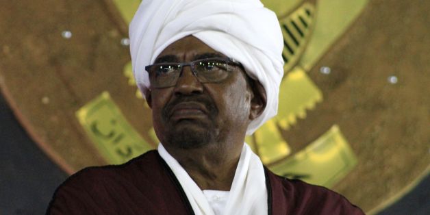 Sudanese President Omar al-Bashir (C) looks on during a celebration to mark the 61st anniversary of Sudans independence from Britain, at the presidential palace in Khartoum, on December 31, 2016. / AFP / ASHRAF SHAZLY (Photo credit should read ASHRAF SHAZLY/AFP/Getty Images)