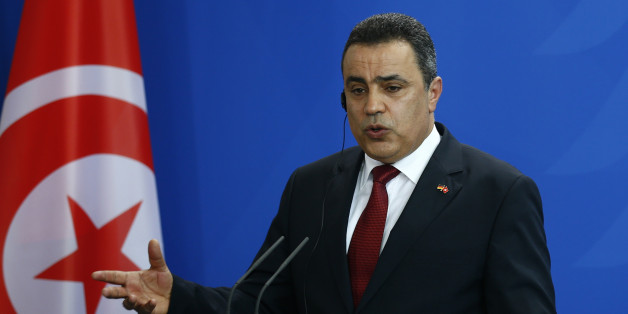Tunisia's Prime Minister Mehdi Jomaa speaks during a news conference after talks with German Chancellor Angela Merkel at the Chancellery in Berlin, June 18, 2014. REUTERS/Thomas Peter (GERMANY - Tags: POLITICS)