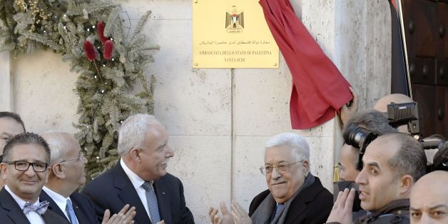 Palestinian president Mahmud Abbas (C, R) applauds after he inaugurated the new Palestinian diplomatic mission to the Holy See with Palestinian Ambassador Issa Kassissieh (L) in Rome on January 14, 2017Abbas meets Pope Francis on the eve of an international conference on Middle East peace in Paris as diplomats play down Israeli fears of a second UN Security Council resolution critical of its actions. / AFP / Tiziana FABI (Photo credit should read TIZIANA FABI/AFP/Getty Images)