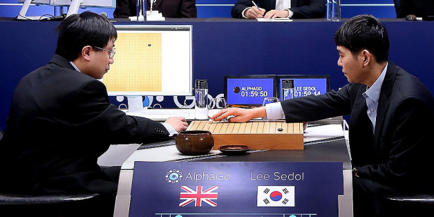 SEOUL, SOUTH KOREA - MARCH 10: In this handout image provided by Google, South Korean professional Go player Lee Se-Dol (R) puts his first stone against Google's artificial intelligence program, AlphaGo, during the Google DeepMind Challenge Match on March 10, 2016 in Seoul, South Korea. Lee Se-dol is playing a five-match series against a computer program developed by a Google, AlphaGo. (Photo by Google via Getty Images)