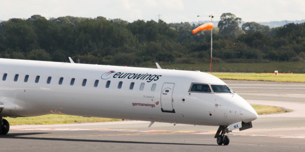 Manchester, United Kingdom - August 27, 2015: Eurowings Bombardier CRJ900 NextGen passenger plane taxiing on Manchester International Airport after landing.