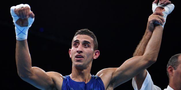 Algeria's Mohamed Flissi reacts after winning against Bulgaria's Daniel during the Men's Fly (52kg) match at the Rio 2016 Olympic Games at the Riocentro - Pavilion 6 in Rio de Janeiro on August 15, 2016. / AFP / Yuri CORTEZ (Photo credit should read YURI CORTEZ/AFP/Getty Images)