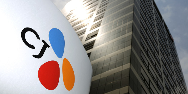 The CJ Group logo is displayed at the company's headquarters in Seoul, South Korea, on Friday, May 31, 2013. President Park Geun Hyeâs government has pledged to crack down on tax evasion to fund her pledges to boost welfare spending. Prosecutors on May 29 searched the home of CJ Group Chairman Lee Jay Hyun. Photographer: SeongJoon Cho/Bloomberg via Getty Images