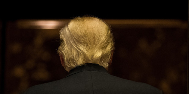 NEW YORK, NY - JANUARY 13: President-elect Donald Trump gets into the elevator after speaking to reporters after his meeting with television personality Steve Harvey at Trump Tower, January 13, 2017 in New York City. President-elect Trump continues to hold meetings at Trump Tower in New York. (Photo by Drew Angerer/Getty Images)