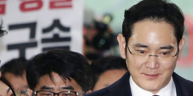 Lee Jae Yong, vice chairman of Samsung Electronics Co., speaks to reporters as he appears at the South Korean special prosecutor's office in Seoul on Jan. 12, 2017, for questioning over the Samsung group's alleged financial support for President Park Geun Hye's confidante Choi Soon Sil in return for business favors. (Photo by Pool/Kyodo News via Getty Images)