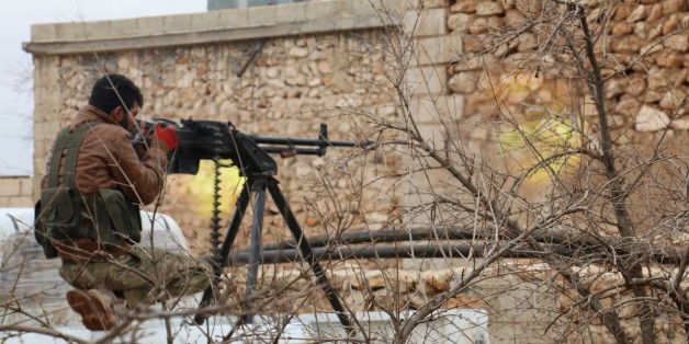 ALEPPO, SYRIA - JANUARY 14: A Free Syrian Army member attacks to Daesh positions during the 'Operation Euphrates Shield' at Al-Bab district in Aleppo, Syria on January 14, 2017. The anti-Daesh operation called Euphrates Shield, which was launched on August 24, aims at improving security, supporting coalition forces, supporting Syrias territorial integrity and eliminating the terror threat along Turkeys border through Free Syrian Army (FSA) fighters backed by Turkish armor, artillery, and jets.