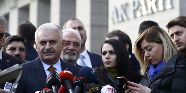 ANKARA, TURKEY - JANUARY 17: Turkish Prime Minister and the leader of Turkey's ruling party, Justice and Development Party (AK Party) Binali Yildirim (C) speaks to media before attending his party's Central Executive Board (MYK) meeting in Ankara, Turkey on January 17, 2017. (Photo by Murat Kula/Anadolu Agency/Getty Images)