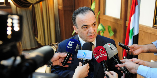 A picture taken on May 11, 2013 shows former electricity minister and newly-appointed Prime Minister Imad Khamis answering journalists' questions following a meeting in the Syrian capital Damascus.Syrian President Bashar al-Assad named Imad Khamis as the new prime minister of the war-ravaged country on June 22, 2016 and tasked him with forming a new government, the official news agency SANA reported. / AFP / STR (Photo credit should read STR/AFP/Getty Images)