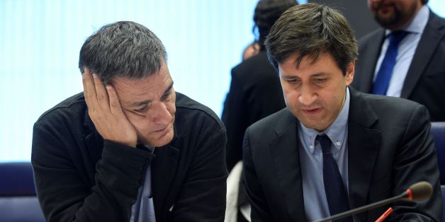 Greek Finance Minister Euclid Tsakalotos (L) listens to a Greek advisor during an Eurogroup meeting in Luxembourg on October 10, 2016.
Greece has delivered the reforms necessary to unlock 2.8 billion euros in rescue loans from its massive third bailout, the European Commission's top economics affairs official said on October 10, 2016. / AFP / JOHN THYS (Photo credit should read JOHN THYS/AFP/Getty Images)
