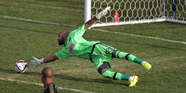 CHESTER, PA - MARCH 21: Fabinho #33 watches as teammate Rais Mbolhi #92 of Philadelphia Union is unable to make a save on the second goal of the second half during the game against FC Dallas at PPL Park on March 21, 2015 in Chester, Pennsylvania. Dallas won 2-0. (Photo by Drew Hallowell/Getty Images)